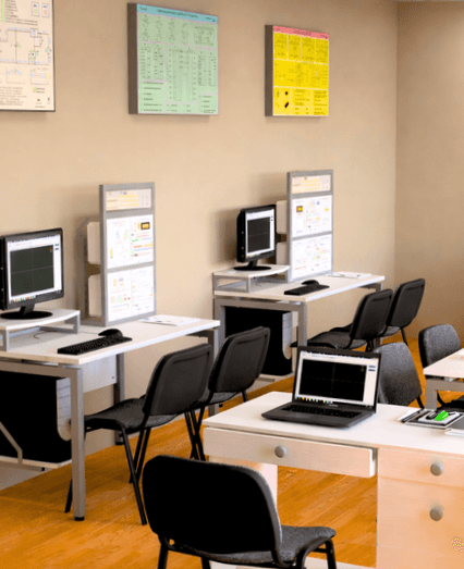 AI Engineering Lab classroom with educational engineering stands, workstations, computers, and laboratory equipment